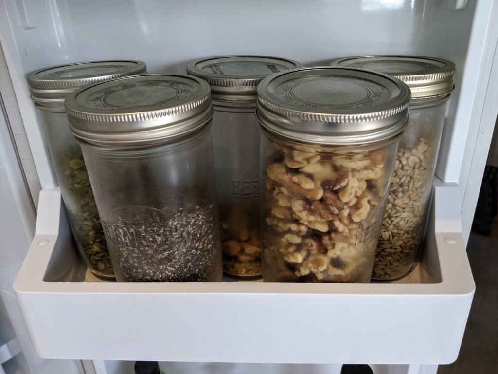 Five wide mouth mason jars fit in the door of the fridge.