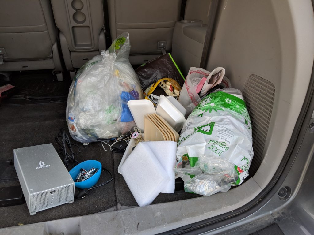 items for the recycling depot in the back of a car - zero waste for beginners step to identify household waste