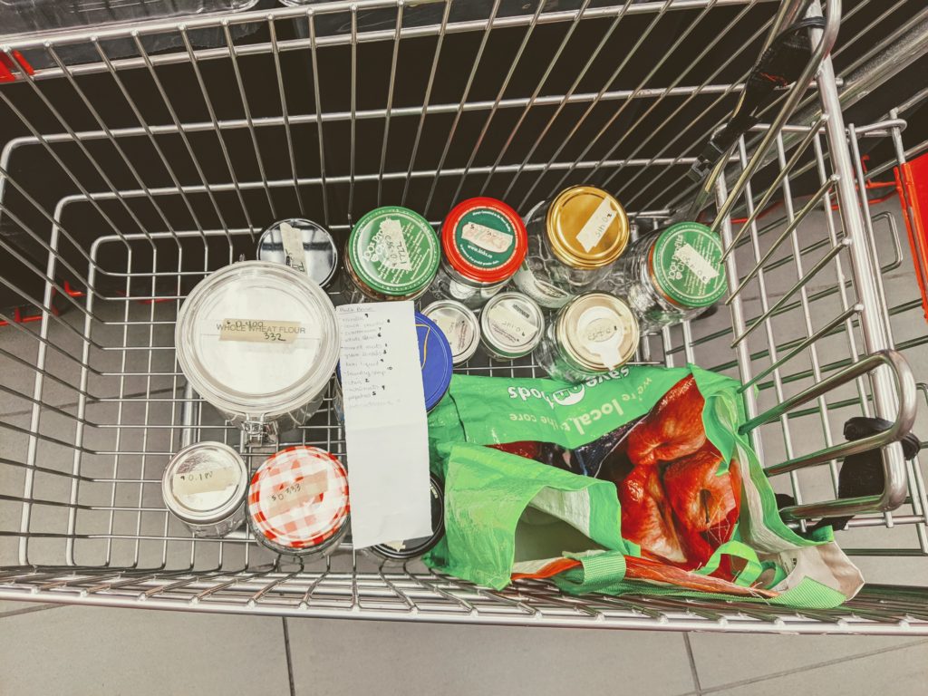 shopping cart with glass jars and a list