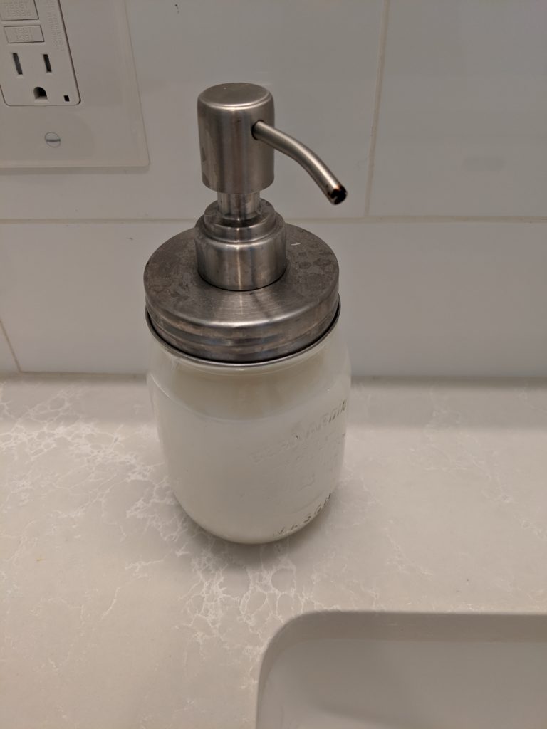 Mason jar with a soap pump attachment.
