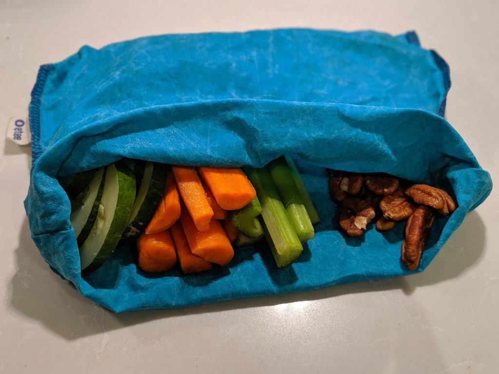 separate veggies and nuts by folding them in the same bag